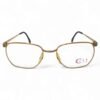 Front view of Zeiss City Collection golden eyeglasses with intricate circular engravings on the bridge and temples.