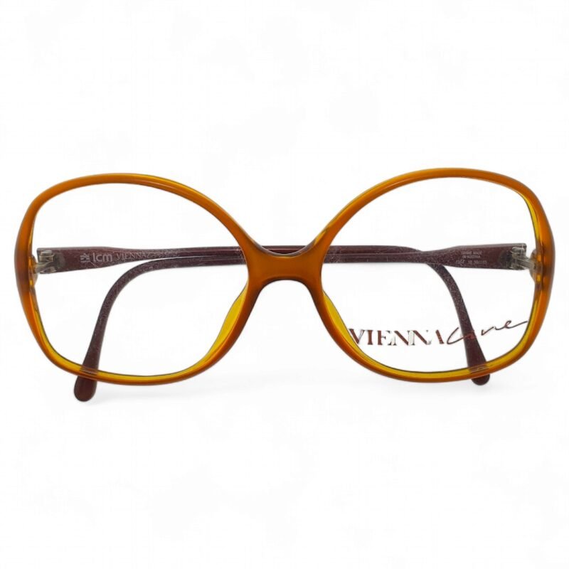 Top down view of ViennaLine vintage amber oval Optyl glasses with soft oval frame shape.