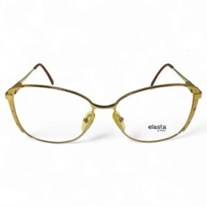 Close-up front view of Safilo Elasta cat-eye glasses in a gold finish, showcasing Italian craftsmanship.